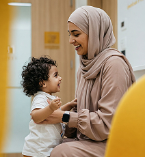 Image of a mother with her child in a medical office